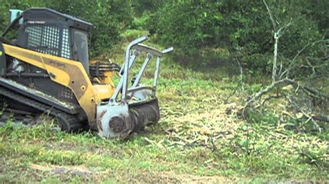 how to clear land with a skid steer|land clearing skid steer attachments.